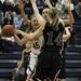 Saline senior Melanie Moella looks to pass under the rim in the game against Woodhaven on Tuesday, March 5. Daniel Brenner I AnnArbor.com